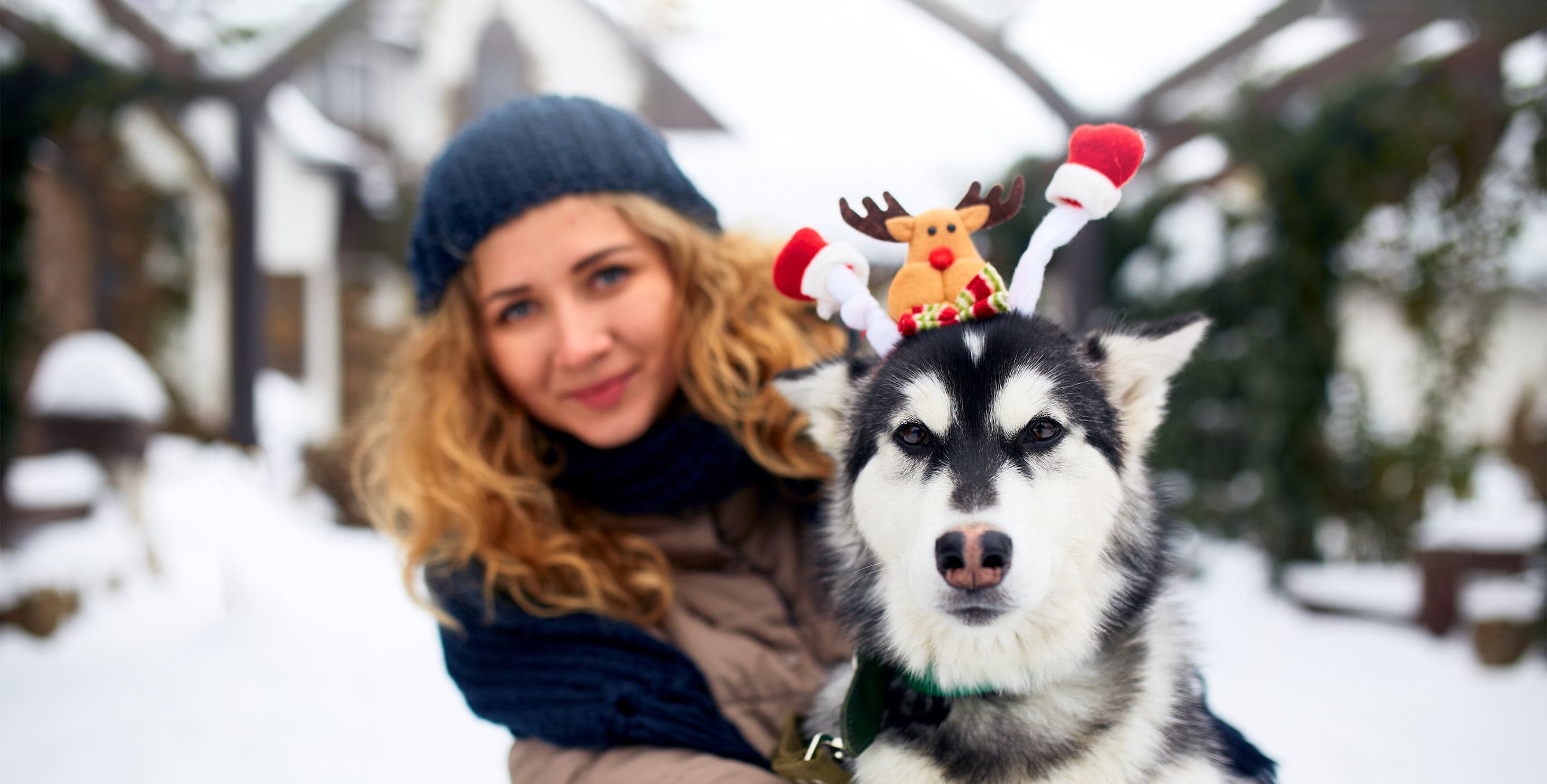 Woman with her cute dog in Winter